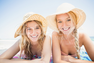 Portrait of happy women lying on the beach