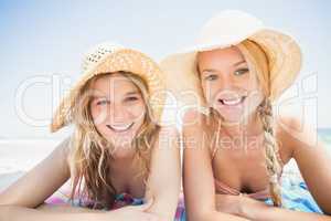 Portrait of happy women lying on the beach