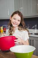 Portrait of smiling girl holding bowl