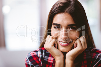 Close-up portrait of smiling young woman