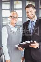 Happy business people with documents