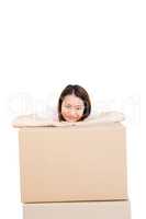 Young woman leaning on cardboard box