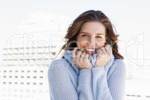 Happy young woman shivering