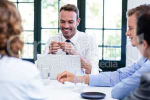 Businessman smiling in a business meeting