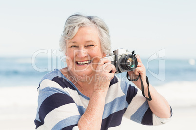 Senior woman taking picture