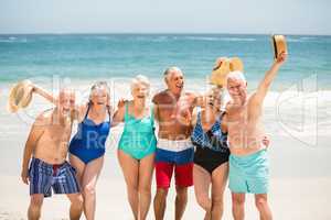 Seniors standing on the beach