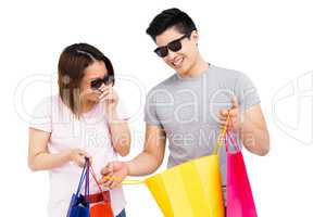 Young couple holding shopping bags