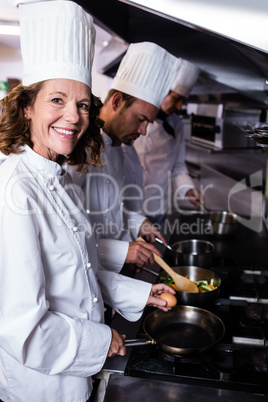 Chef preparing egg in the kitchen