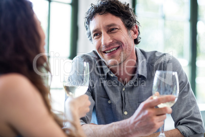 Couple holding wine glass and interacting