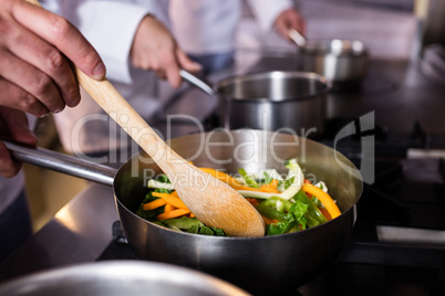 Close-up of chef preparing food