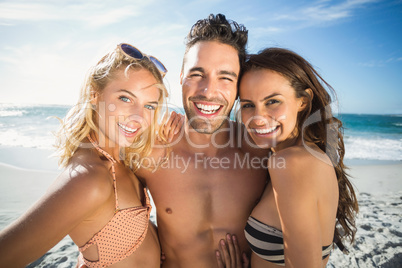 Happy friends enjoying moment on the beach
