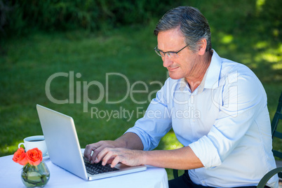 Casual businessman using laptop