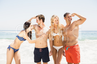 Happy friends enjoying together on the beach