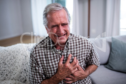 Senior man suffering from heart attack