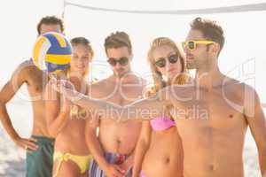 Friends playing beach volley