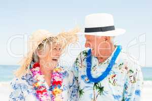 Senior couple standing at the beach