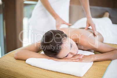 Woman receiving back massage