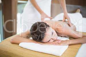 Woman receiving back massage