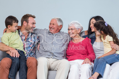 Family sitting on sofa