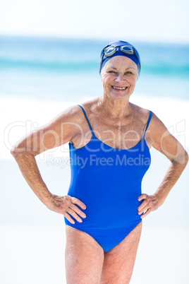 Pretty mature woman posing on the beach