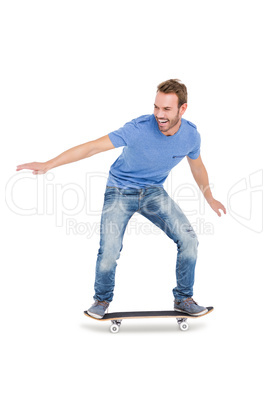 Happy young man skateboarding