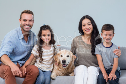 Family with dog in living room