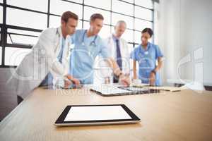 Digital tablet on table in conference room