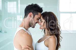 Young romantic couple standing face to face