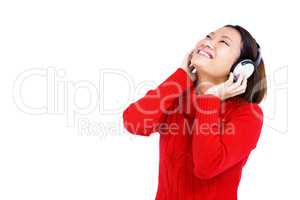 Young woman listening to music on headphone