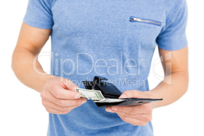 Young man removing money from his wallet