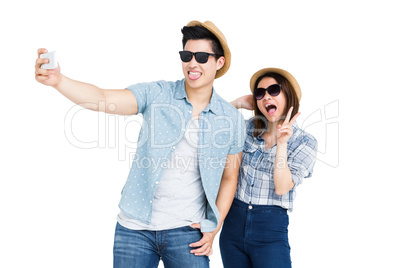 Happy young couple taking a selfie