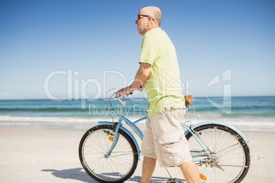 Smiling senior man with bike