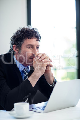 Thoughtful businessman in restaurant Thoughtful businessman in restaurant
