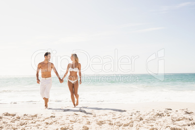 Young couple holding hands