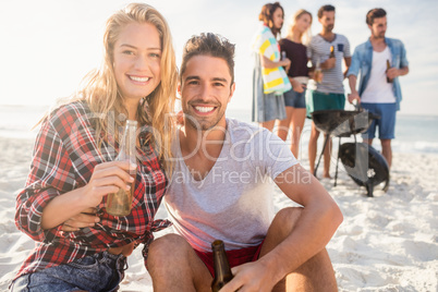 Happy friends having fun around barbecue