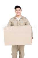 Delivery man holding cardboard box