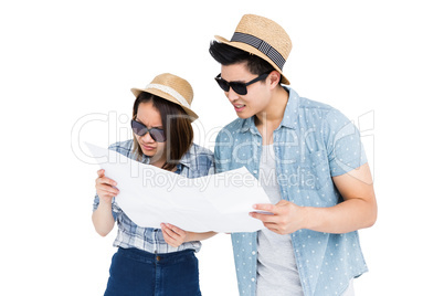 Young couple using map for direction