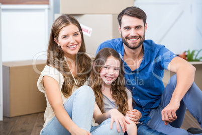 Portrait of family sitting on floor