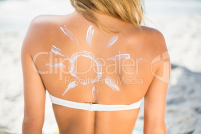 Woman with sunscreen on her skin