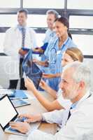 Medical team smiling in conference room