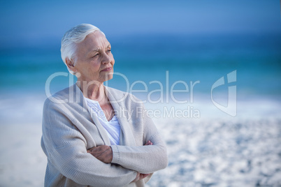 Thoughtful mature woman day dreaming