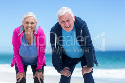 Mature couple tired after running