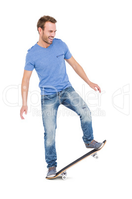 Happy young man skateboarding