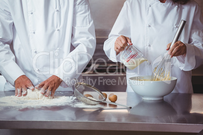 Focused chef preparing a cake
