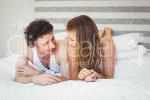 Young couple relaxing on bed