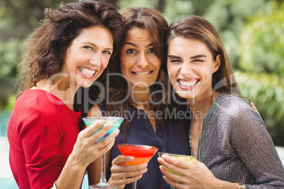 Beautiful female friends making face at party