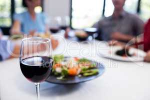 Glass of red wine on the restaurant table