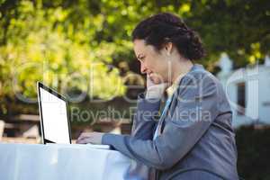 Businesswoman using laptop