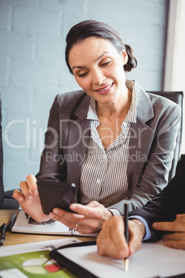 Businesswoman using mobile phone