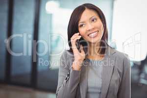Attractive businesswoman talking on mobile phone